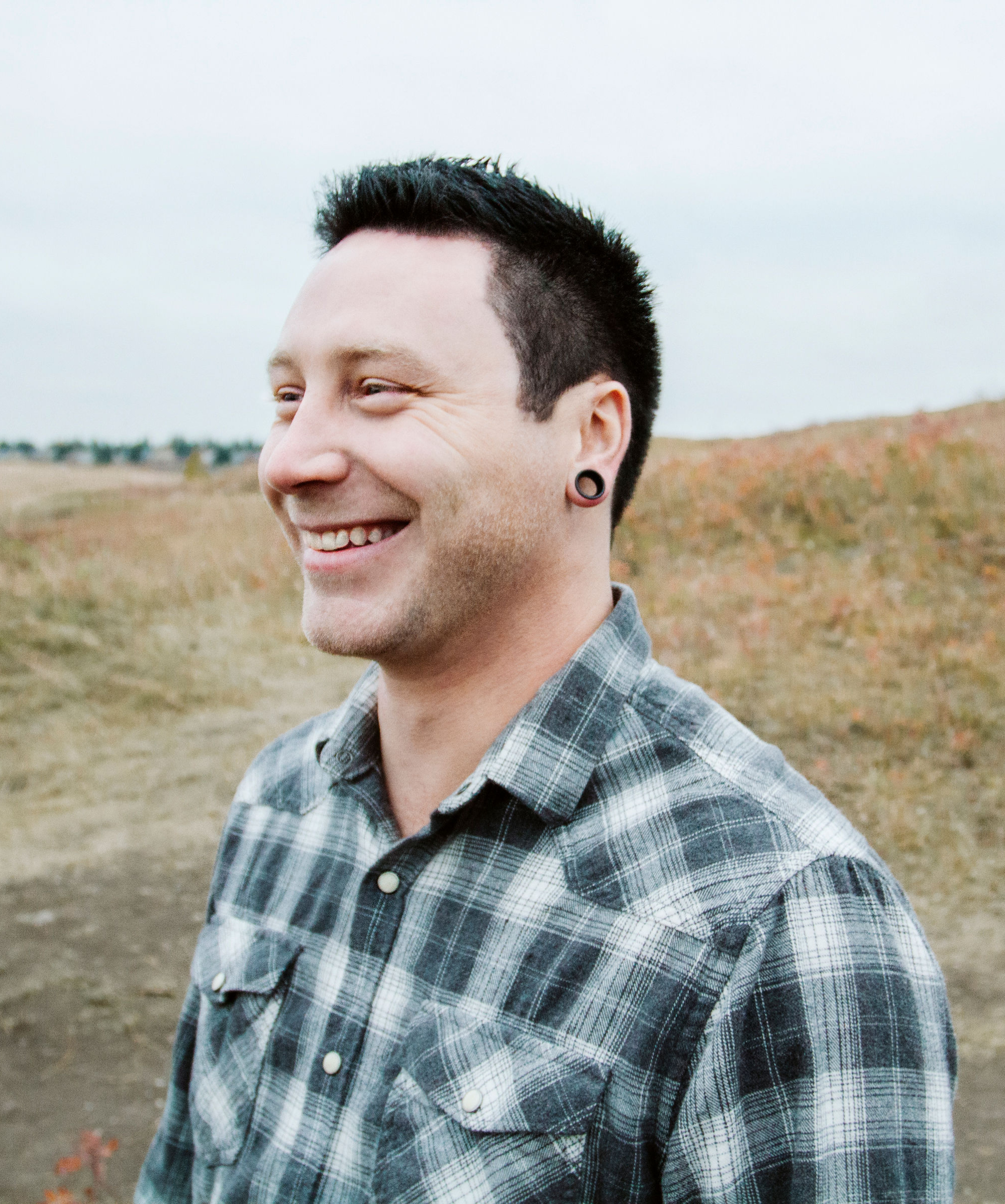 Headshot from the side of Cameron Remesz smiling